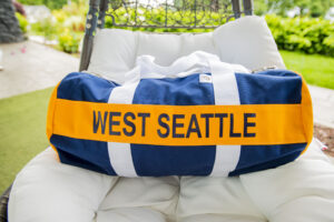 West Seattle High School Booster Club Blue, yellow, and white West Seattle Athletic Bag.