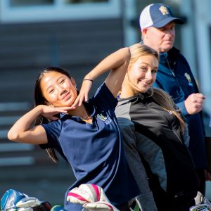 West Seattle High School Women's Golf Lauryn Nguyen poses with West Seattle High School Women's Golf teammate and coach.